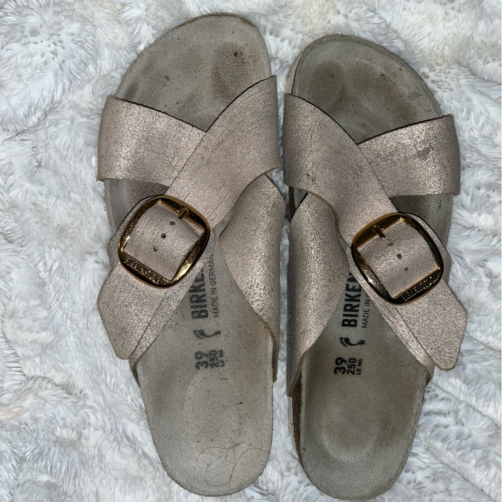 Birkenstockck criss cross sandals.